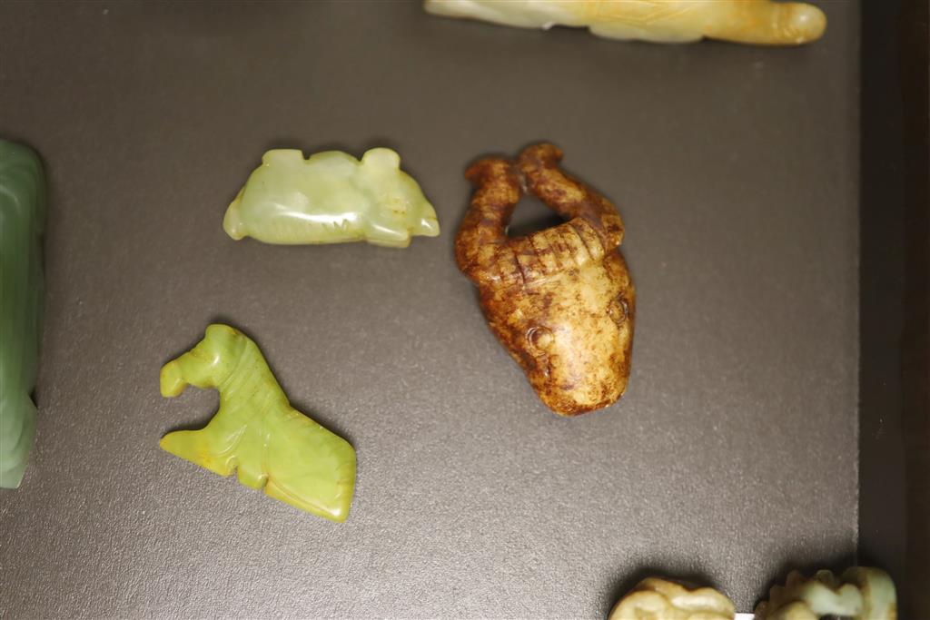 Six Chinese jade and hardstone animal carvings, two dragon belt hooks, a rams head and a soapstone seal, 10cm